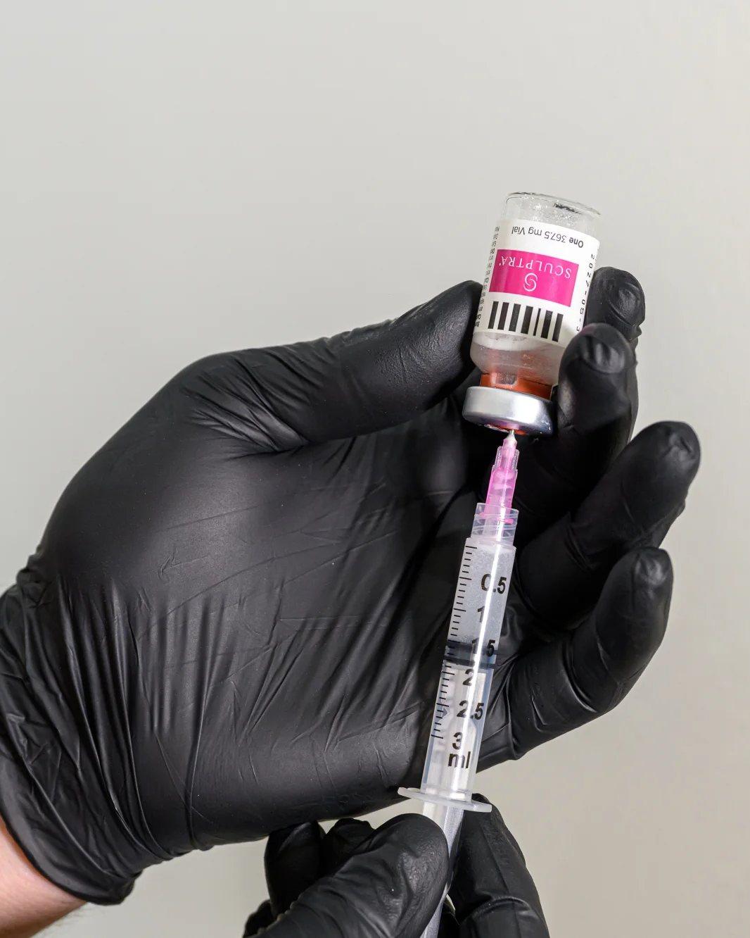 A vial of Sculptra being drawn up into a syringe at Mike Lee Laser & Skin Clinic